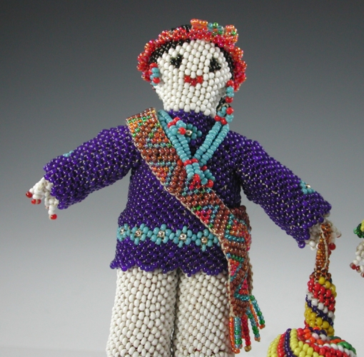 Beaded man and woman by Annie Hooee