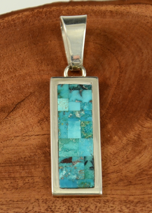 Sterling Silver and Natural Turquoise are expertly inlaid this this wonderful bracelet by Navajo artist, Tommy Jackson.